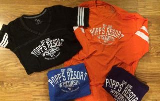 Orange, Black, and Blue Popp's Resort jersey shirts