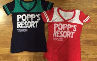 Popp's Resort Red/White and Black/Green women's jersey shirts.