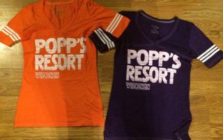Orange and Black Popp's Resort jersey shirts.